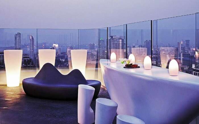Well lit dining space atop the roof at Aer Four Seasons Mumbai 