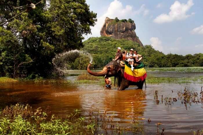 Tourists taking elephant ride in Kandy