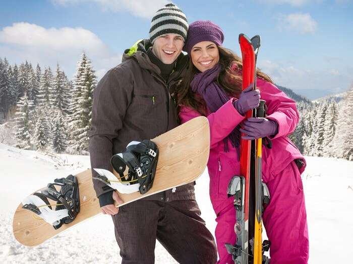 A couple trying adventure sports at a ski resort