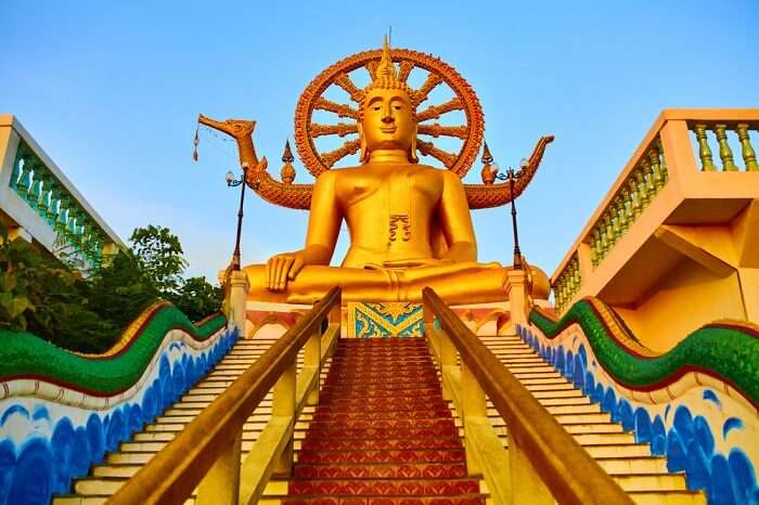 Golden Statue Of Buddha With Dragon Staircase In Wat Phra Yai or the Big Buddha Temple in Koh Samui