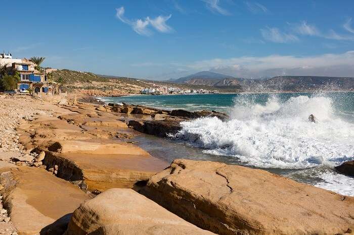 Ocean waves splashing against the rocks near Taghazout to the north of Agadir in Morocco