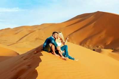 Loving couple in the Sahara Desert of Morocco