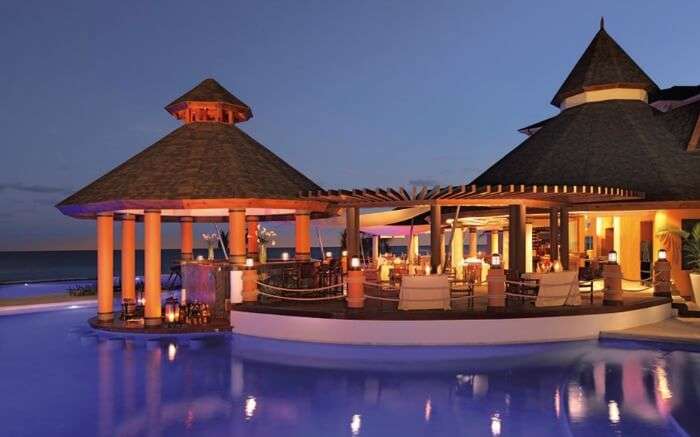 A hutlike resort in Jamaica at night 