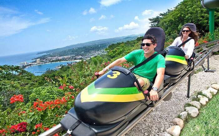 Couple taking a ride in sky explorer at Mystic Mountain 