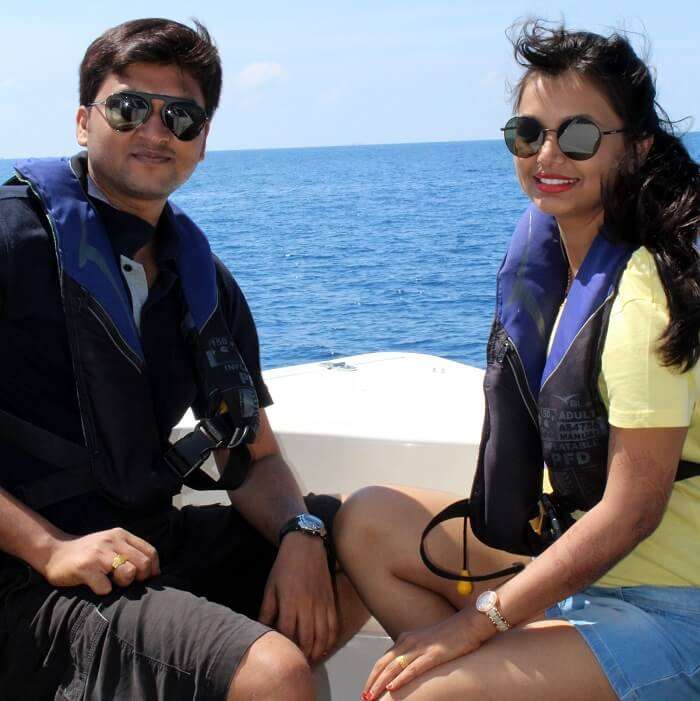 couple in motorboat maldives
