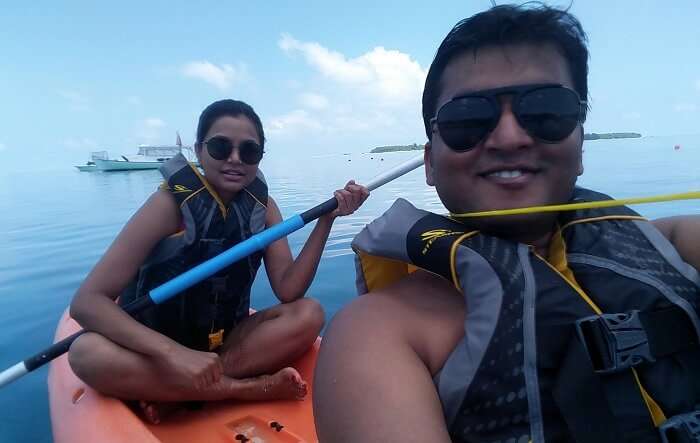 couple doing kayaking in maldives