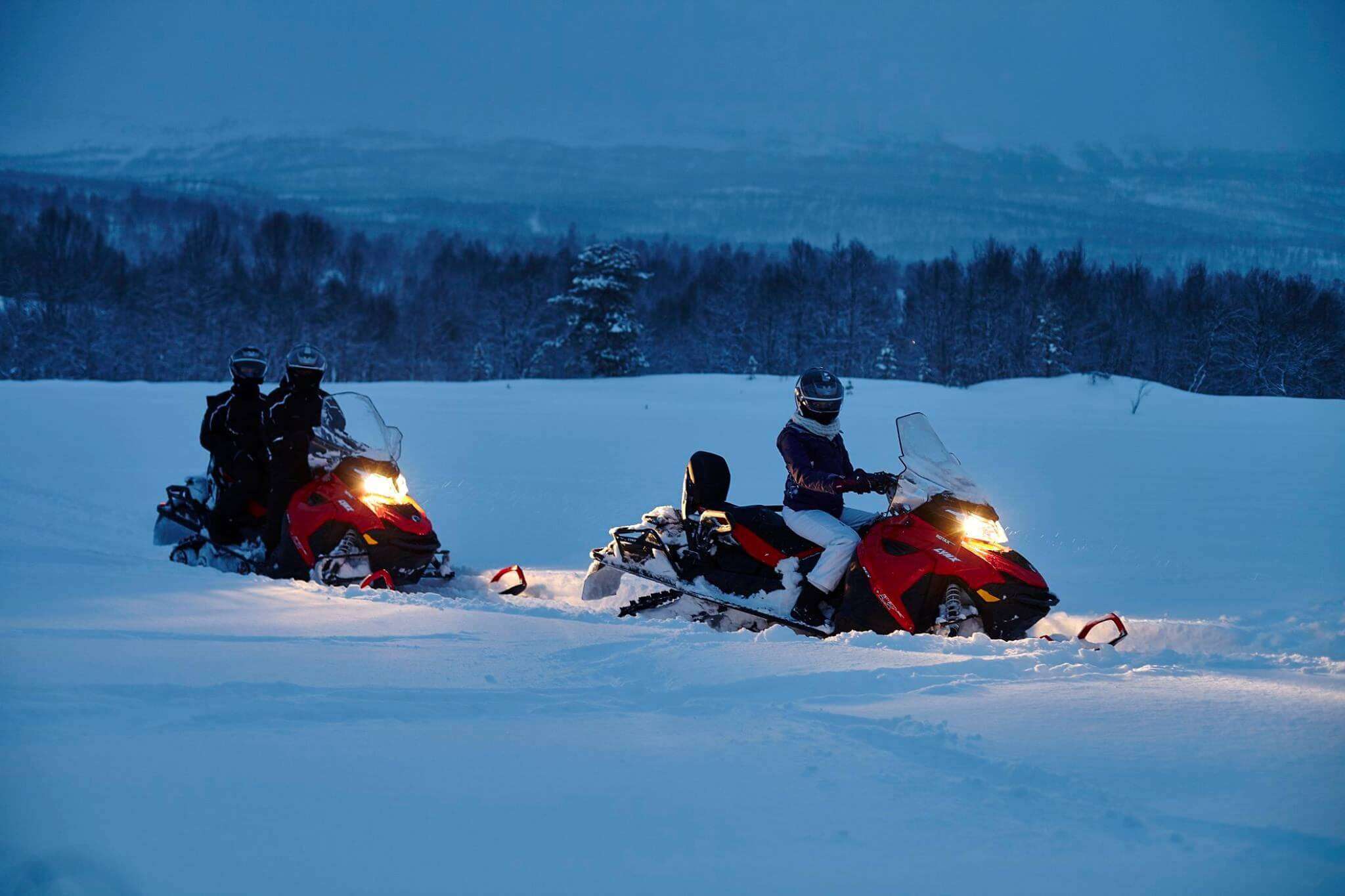 snowmobiles in snow covered Norway