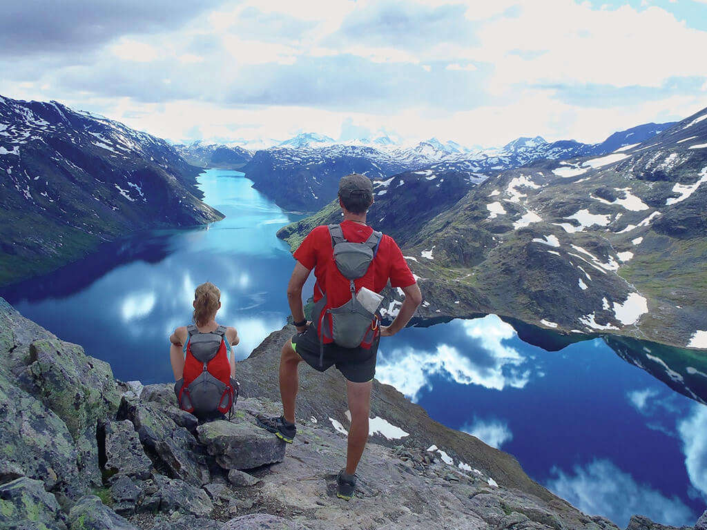 a couple looking at the lake from a cliff