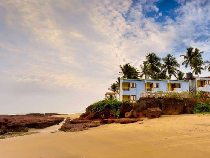 A beautiful hotel and coconut palm trees on a beach