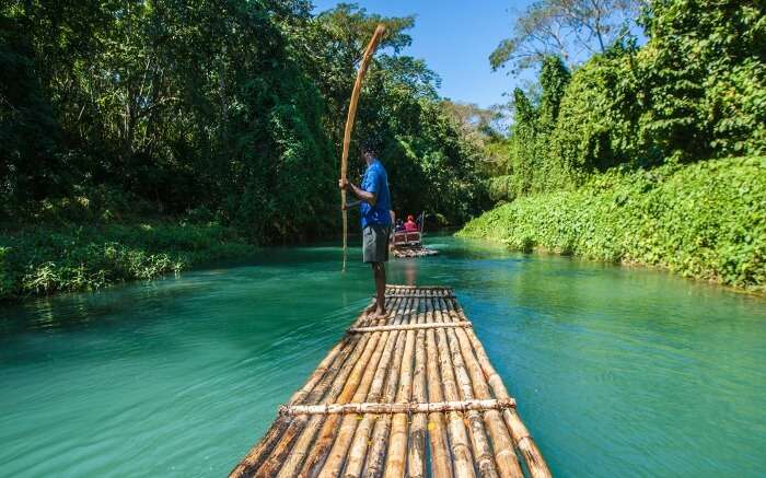 Traditional bamboo boat sailing on Rio Grande River 