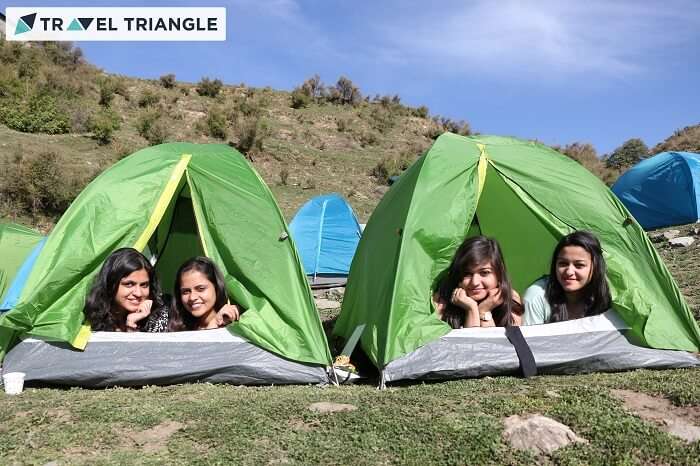 Girls relaxing in their tents at the campsite of Bir Billing