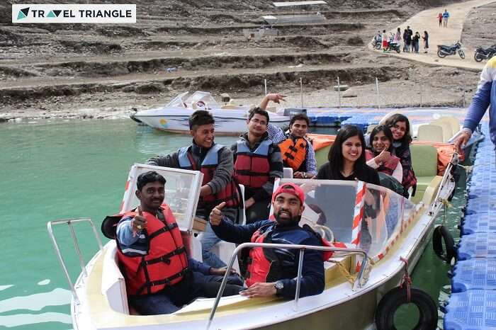 A group of travelers on a speedboat in Tehri dam on a weekend trip from Delhi to Kanatal