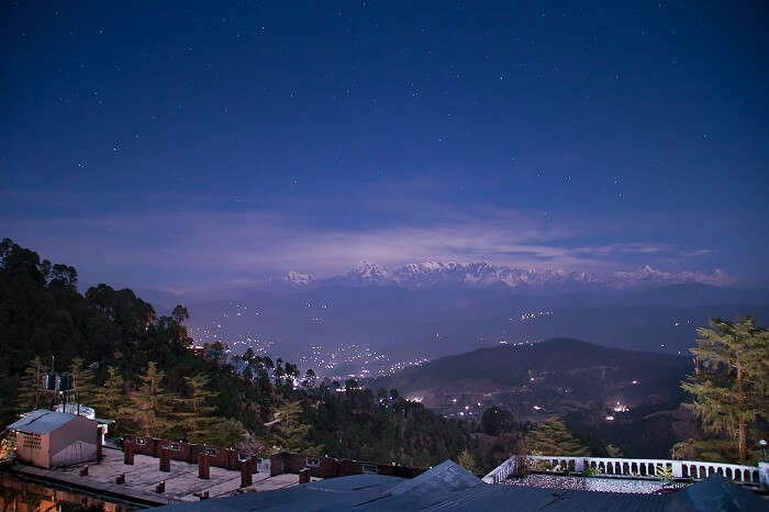 A night shot of the valley and hills as seen from a resort in Kausani