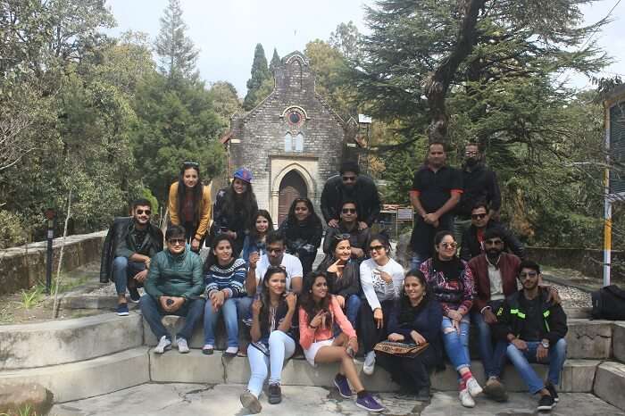 A group of travelers pose outside a tourist attraction in Lansdowne