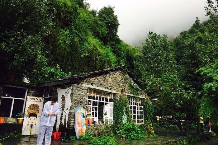 A traveler standing outside the beautiful Shiva Cafe in Mcleodganj