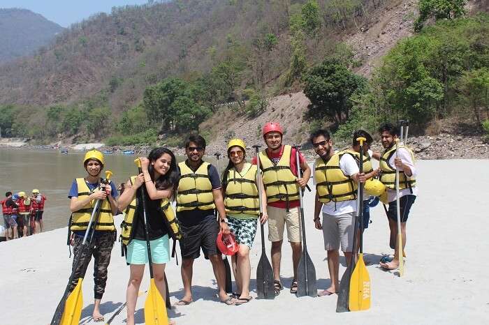 A group of travelers ready for river rafting on their weekend trip from Delhi to Rishikesh