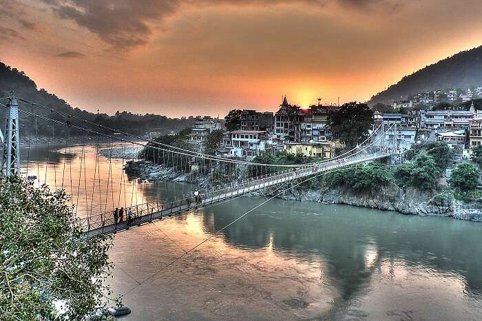 A sunset view of the Laxman Jhula and the city of Rishikesh