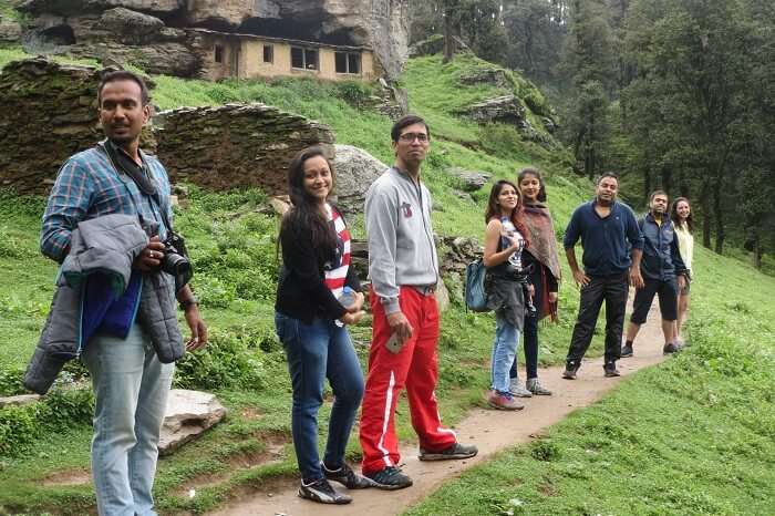 A group of travelers hiking in the Tirthan Valley