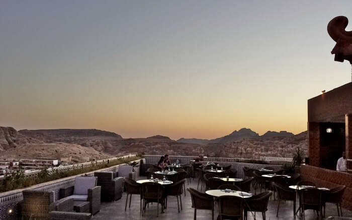 romantic sitting area of terrace with mountain views