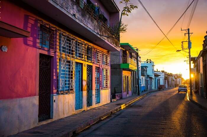 The warm sunset light shines on the empty streets of the world heritage city centre in the Cuban city of Camaguey island in Caribbean
