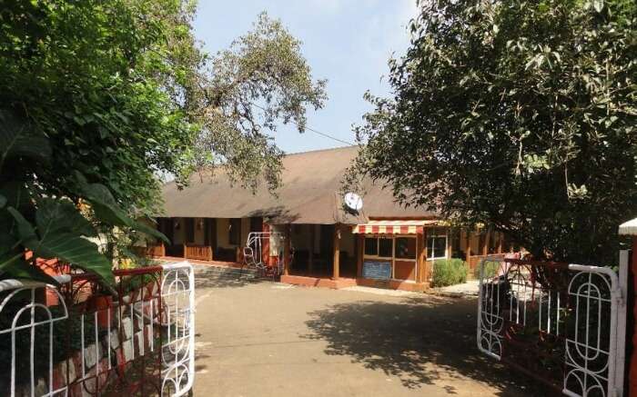 A cottage like hotel surrounded by trees in Mahabaleshwar 