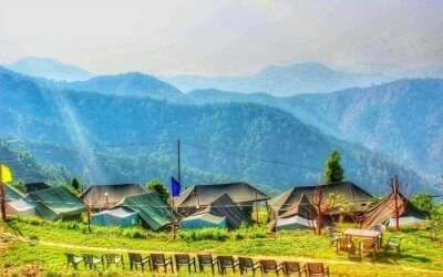A glorious view of Kanatal Orchid Camps overlooking the vast mountains in Kanatal
