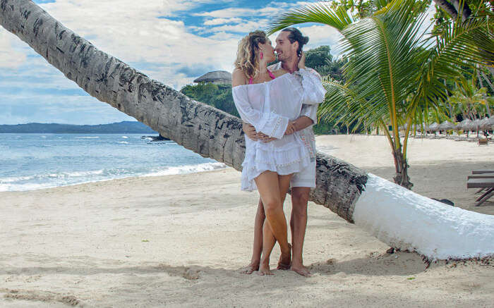 Couple romancing by a sea beach in Madagascar