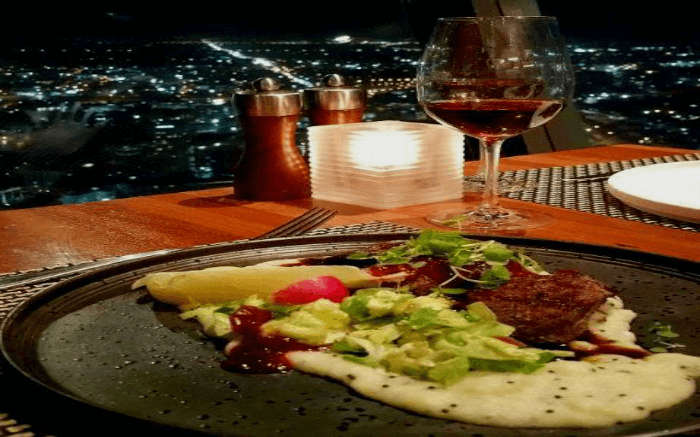 Dinner laid out on the dining table at 360-degree dining in Skytower