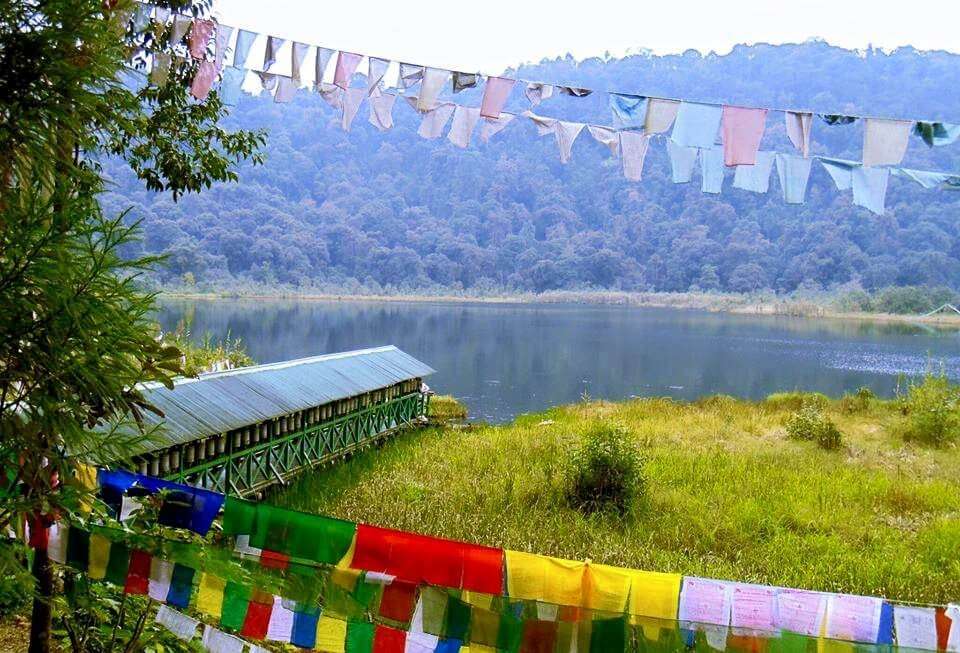 colorful prayer flags in hills