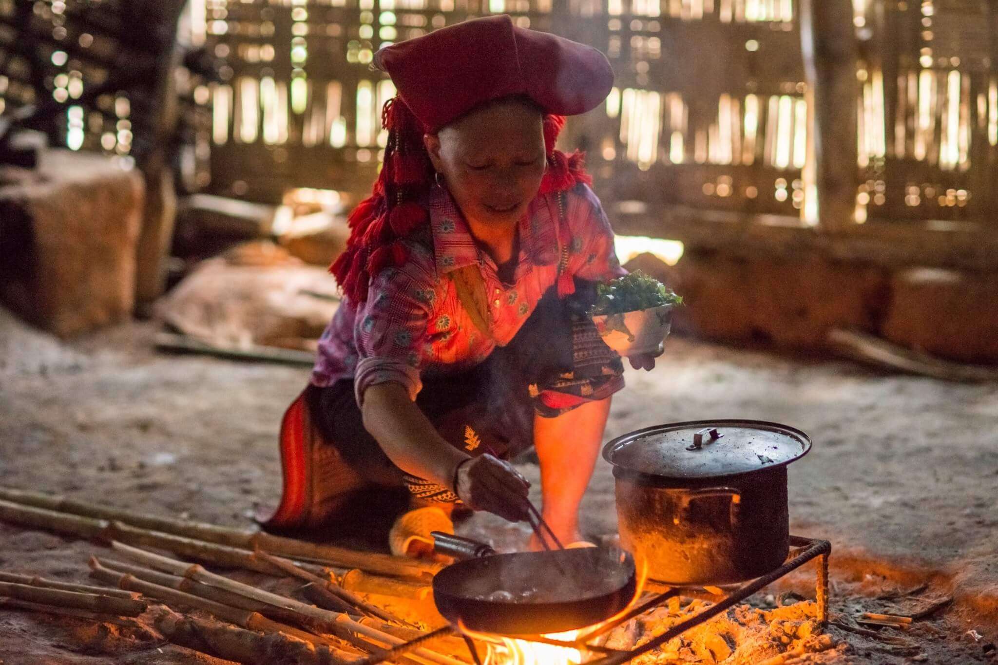 a homestay host lady cooking food 