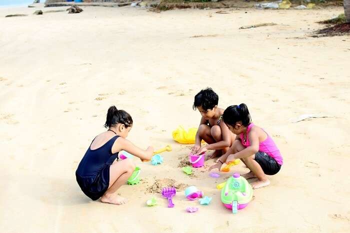 Kids making sandcastles on the beach