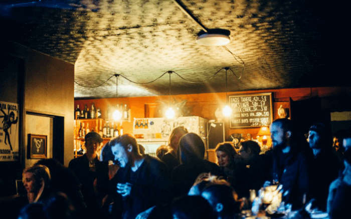 People celebrating and drinking at Darkroom in Christchurch in New Zealand