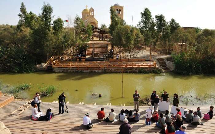 Pilgrims at riverbank in Qasr el Yahud in Jordan
