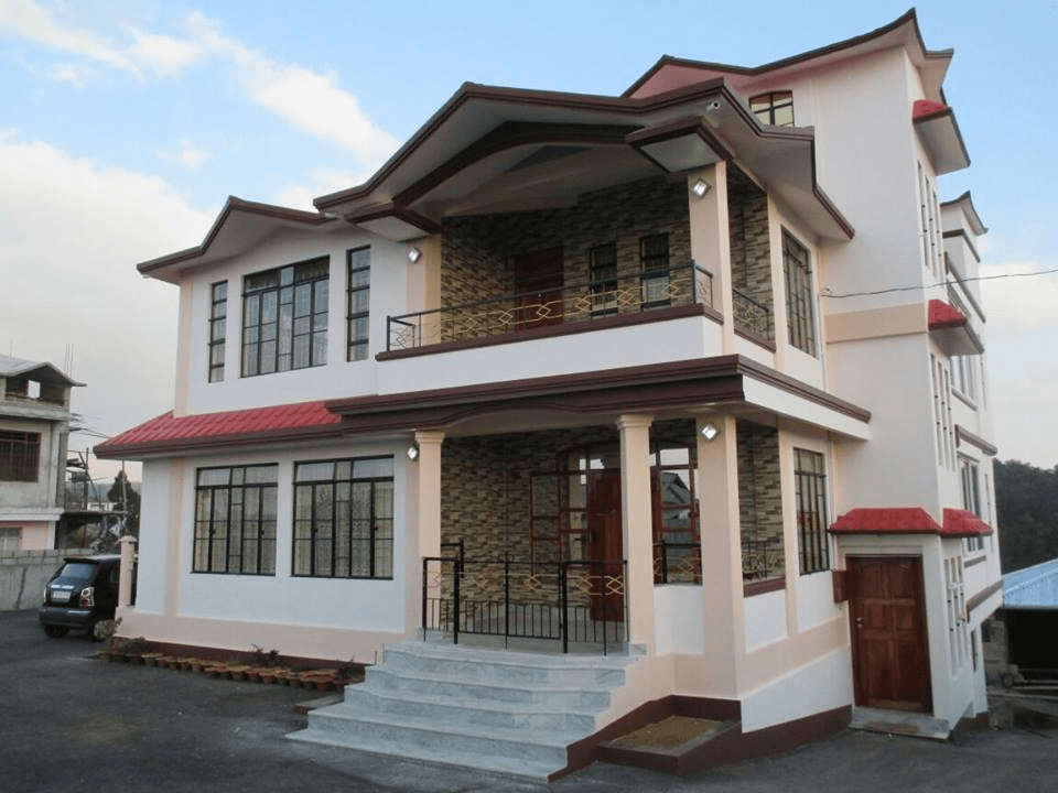 a beautiful pink homestay building 