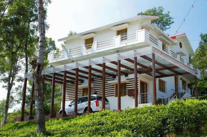 A car parked in front of LMF Paradise Villa in Ooty