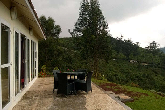 Private seating area of Rohan Villa overlooking a balcony in Ooty