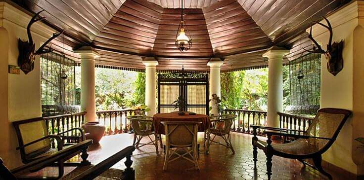 a traditional porch area on a hotel