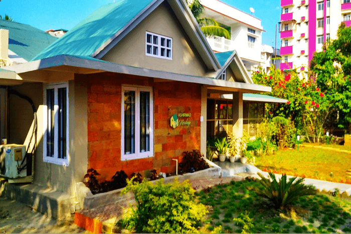 a colorful homestay with a garden 