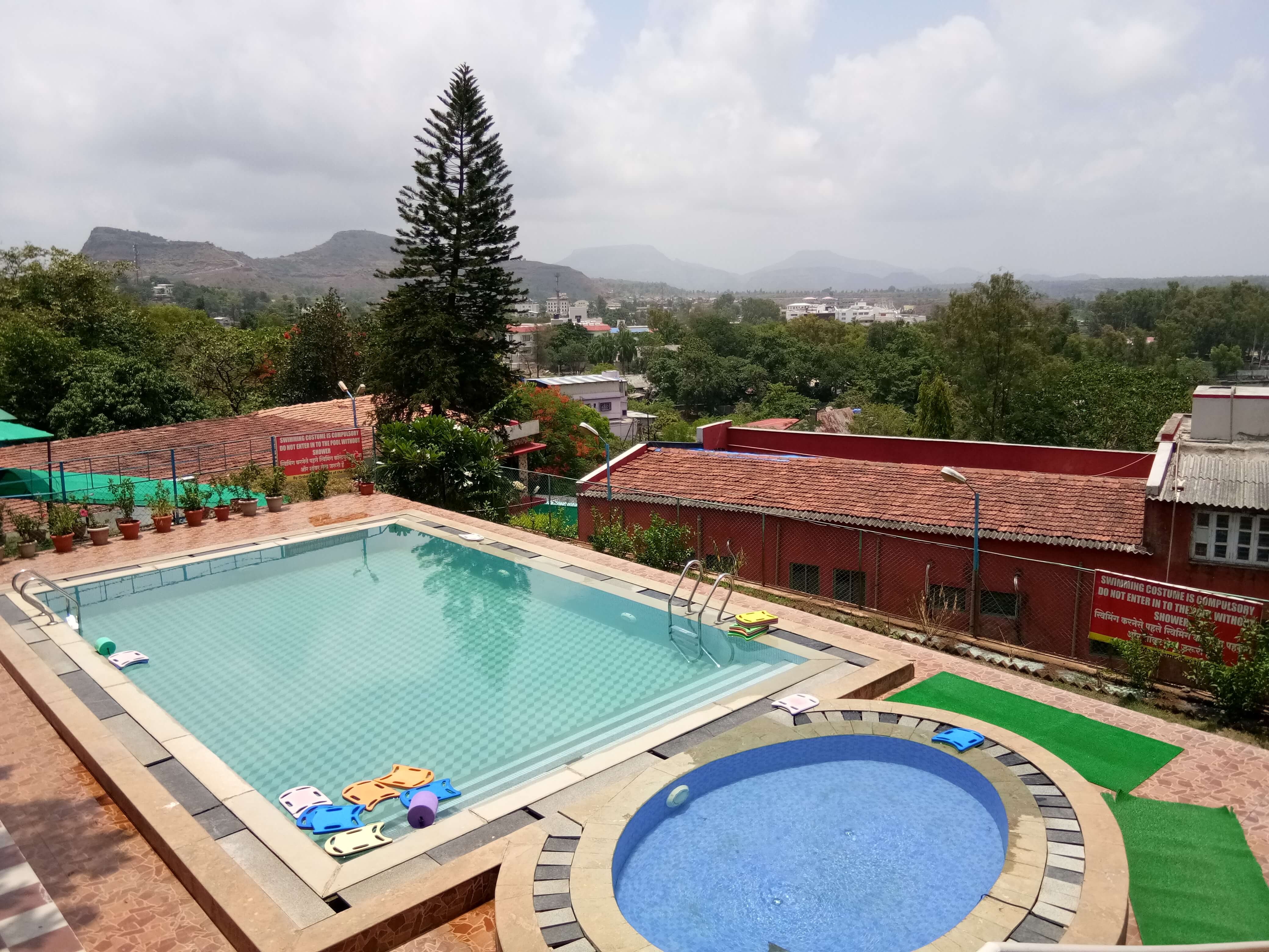 two outdoor pools in a resort in Saputara