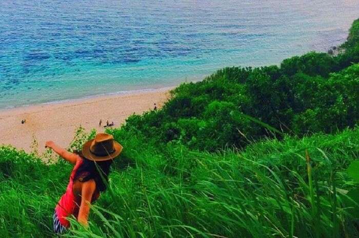 view serene views from the cliff of gunung payung beach