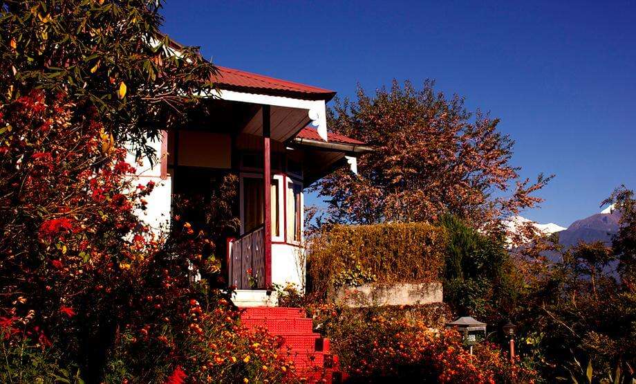 a red painted resort amid trees