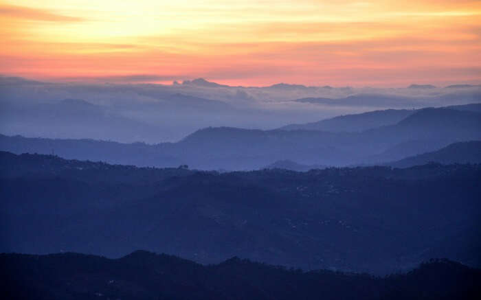 Orange sky after sunset in the mountains