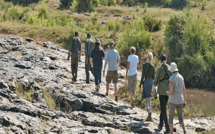 Travelers taking walking through the Nyalaland Wilderness Trail in Kruger