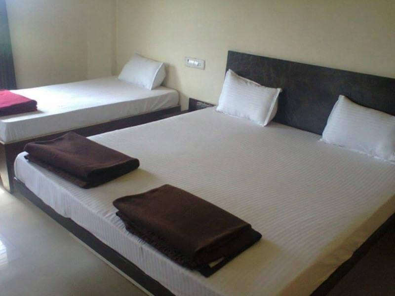 two bed with white cover with black blanket