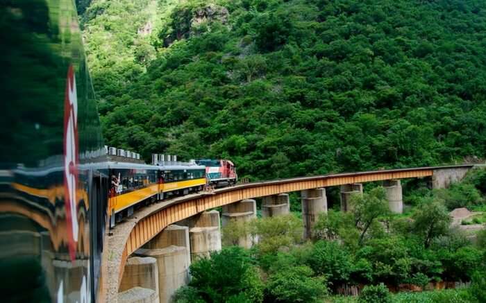 An El Chepe train crossing a bridge in Mexico