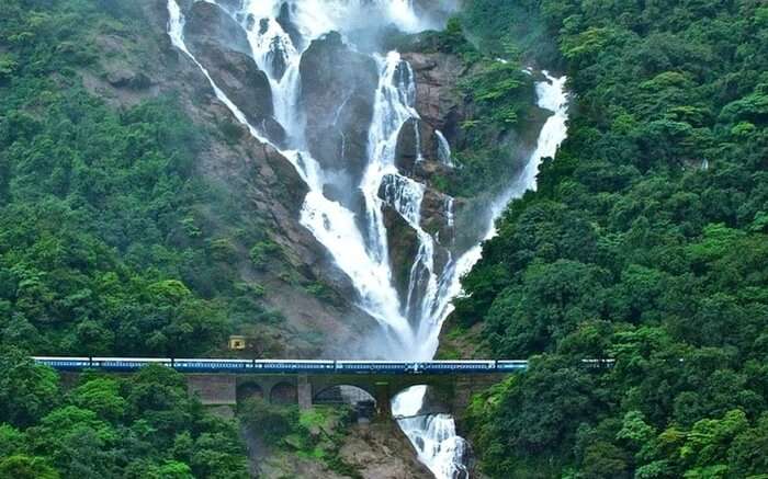 An Indian Railway train crossing the Dudhsagar Falls near Goa