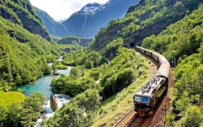 A train of Bergen Railway running across the mountains in Norway