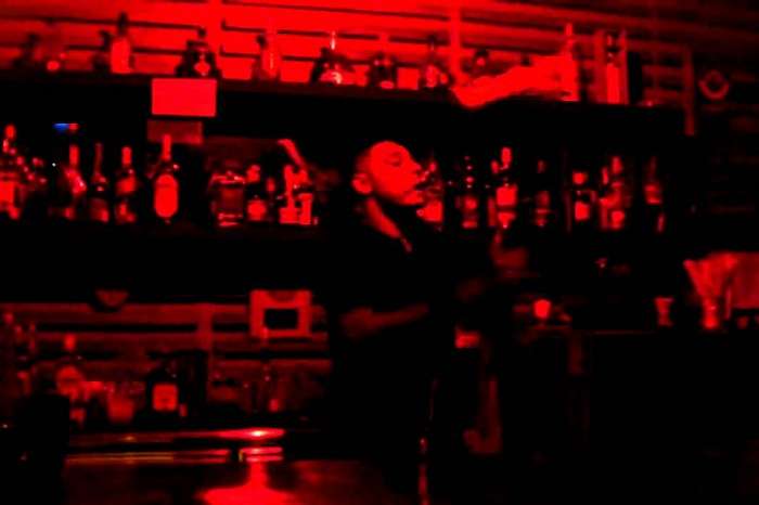 The bartender at Level 3 Bar in Mahe juggling drink bottles and glasses