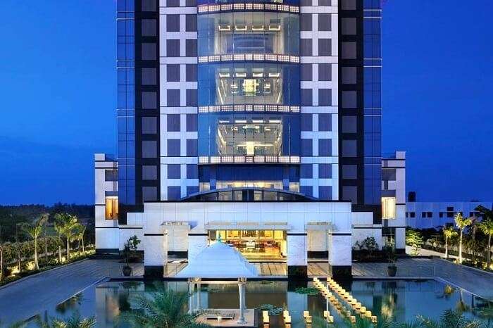 An evening shot of the main building of Le Meridien hotel in Coimbatore