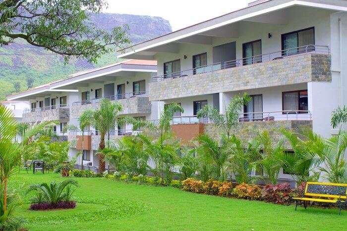 a green lawn outside a resort